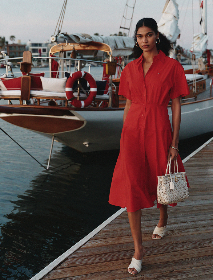 Tommy Hilfiger SS26 — red poplin shirt dress on the harbour